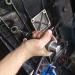 A tricky way to unscrew bolts with a torn hexagon